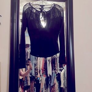 The limited, small, black, sheer, sexy, long sleeve blouse with embroidery.